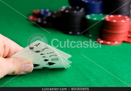 To use this stock image in your creative project, please select the size you need over to the right and click the "Add to Cart" button.
Your downloaded image will come with the Cutcaster watermark removed so don’t worry about the watermark you see on this page. Royal Flush stock photo, A royal flush in spades with poker chips in the background by Tyler Olson