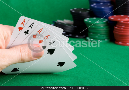 To use this stock image in your creative project, please select the size you need over to the right and click the "Add to Cart" button.
Your downloaded image will come with the Cutcaster watermark removed so don’t worry about the watermark you see on this page. Three of a Kind stock photo, A poker hand with three of a kind Aces by Tyler Olson