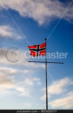 To use this stock image in your creative project, please select the size you need over to the right and click the "Add to Cart" button.
Your downloaded image will come with the Cutcaster watermark removed so don’t worry about the watermark you see on this page. Norwegian Flag stock photo, A norwegian flag blowing in the wind against a blue sky by Tyler Olson