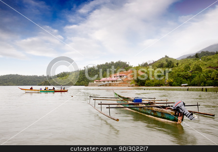 To use this stock image in your creative project, please select the size you need over to the right and click the "Add to Cart" button.
Your downloaded image will come with the Cutcaster watermark removed so don’t worry about the watermark you see on this page. Indonesian Traditional Boat stock photo, A pair of traditional boats in Indonesia by Tyler Olson