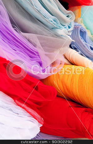 To use this stock image in your creative project, please select the size you need over to the right and click the "Add to Cart" button.
Your downloaded image will come with the Cutcaster watermark removed so don’t worry about the watermark you see on this page. Silk Cloth stock photo, A background of various rolls of cloth by Tyler Olson
