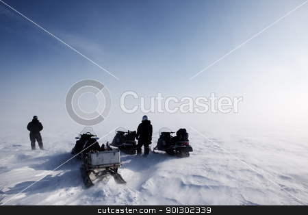 To use this stock image in your creative project, please select the size you need over to the right and click the "Add to Cart" button.
Your downloaded image will come with the Cutcaster watermark removed so don’t worry about the watermark you see on this page. Blowing Snow Landscape stock photo, A blowing snow landscape with three snowmobiles on an expedition by Tyler Olson