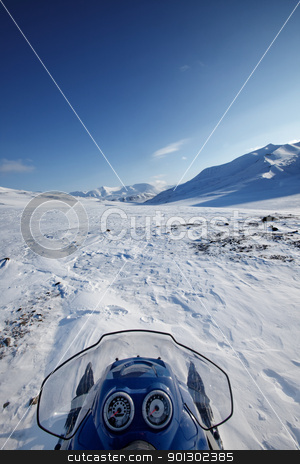 To use this stock image in your creative project, please select the size you need over to the right and click the "Add to Cart" button.
Your downloaded image will come with the Cutcaster watermark removed so don’t worry about the watermark you see on this page. Snowmobile Winter Landscape stock photo, A snowmobile on a winter wilderness landscape by Tyler Olson