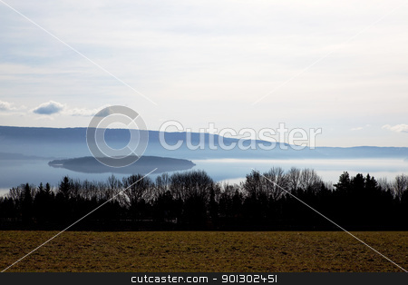 To use this stock image in your creative project, please select the size you need over to the right and click the "Add to Cart" button.
Your downloaded image will come with the Cutcaster watermark removed so don’t worry about the watermark you see on this page. Lake Landscape stock photo, A soothing calm lake landscape, Buskerud, Norway by Tyler Olson