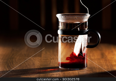 To use this stock image in your creative project, please select the size you need over to the right and click the "Add to Cart" button.
Your downloaded image will come with the Cutcaster watermark removed so don’t worry about the watermark you see on this page. Tea stock photo, A tea bag in a cup of hot water with strong directional morning light by Tyler Olson