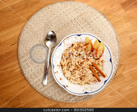 To use this stock image in your creative project, please select the size you need over to the right and click the "Add to Cart" button.
Your downloaded image will come with the Cutcaster watermark removed so don’t worry about the watermark you see on this page. Porridge stock photo, A bowl of porridge with apple and cinnamon spices viewed from above by Tyler Olson