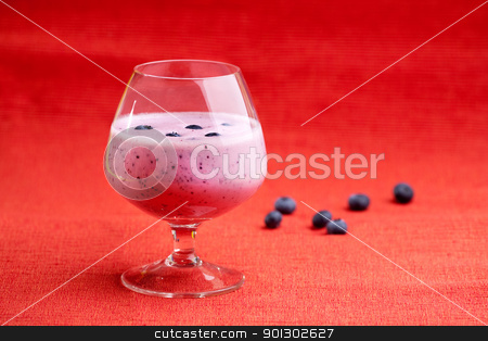 To use this stock image in your creative project, please select the size you need over to the right and click the "Add to Cart" button.
Your downloaded image will come with the Cutcaster watermark removed so don’t worry about the watermark you see on this page. Blueberry Drink stock photo, A delicious blueberry smoothie on a red background by Tyler Olson