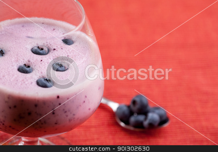To use this stock image in your creative project, please select the size you need over to the right and click the "Add to Cart" button.
Your downloaded image will come with the Cutcaster watermark removed so don’t worry about the watermark you see on this page. Blueberry Drink stock photo, A delicious blueberry smoothie over a red cloth background by Tyler Olson