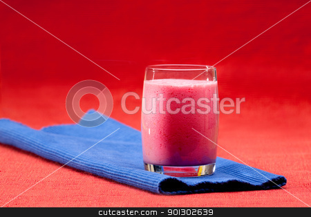 To use this stock image in your creative project, please select the size you need over to the right and click the "Add to Cart" button.
Your downloaded image will come with the Cutcaster watermark removed so don’t worry about the watermark you see on this page. Berry Smoothie stock photo, A red berry smoothie isolated on blue and red by Tyler Olson