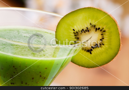 To use this stock image in your creative project, please select the size you need over to the right and click the "Add to Cart" button.
Your downloaded image will come with the Cutcaster watermark removed so don’t worry about the watermark you see on this page. Kiwi Fruit Drink stock photo, A tasty kiwi smoothie in a natural setting with macro detail on kiwi slice by Tyler Olson