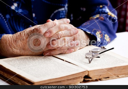 To use this stock image in your creative project, please select the size you need over to the right and click the "Add to Cart" button.
Your downloaded image will come with the Cutcaster watermark removed so don’t worry about the watermark you see on this page. Hands Praying stock photo, An old pair of hands in prayer on a book by Tyler Olson
