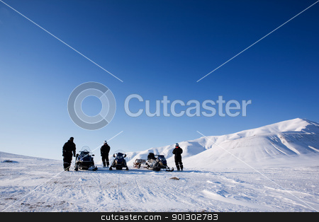 To use this stock image in your creative project, please select the size you need over to the right and click the "Add to Cart" button.
Your downloaded image will come with the Cutcaster watermark removed so don’t worry about the watermark you see on this page. Snomobile Adventure stock photo, Three people with snowmobiles in an arctic landscape by Tyler Olson