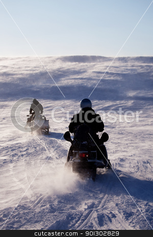 To use this stock image in your creative project, please select the size you need over to the right and click the "Add to Cart" button.
Your downloaded image will come with the Cutcaster watermark removed so don’t worry about the watermark you see on this page. Winter Travel stock photo, Two people riding up a hill on snowmobiles by Tyler Olson