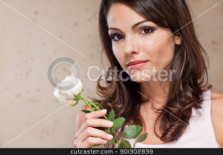 To use this stock image in your creative project, please select the size you need over to the right and click the "Add to Cart" button.
Your downloaded image will come with the Cutcaster watermark removed so don’t worry about the watermark you see on this page. Attractive young female holding a white rose stock photo, An attractive young female holding a white rose by Tyler Olson