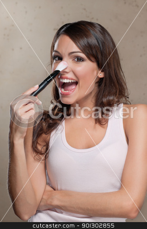 To use this stock image in your creative project, please select the size you need over to the right and click the "Add to Cart" button.
Your downloaded image will come with the Cutcaster watermark removed so don’t worry about the watermark you see on this page. Woman applying blusher on nose stock photo, Portrait of a young smiling woman applying blusher on nose by Tyler Olson