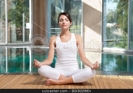 To use this stock image in your creative project, please select the size you need over to the right and click the "Add to Cart" button.
Your downloaded image will come with the Cutcaster watermark removed so don’t worry about the watermark you see on this page. Woman doing yoga exercise stock photo, Pretty young woman with eyes closed doing yoga exercise on mat by Tyler Olson
