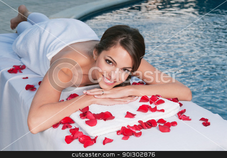 To use this stock image in your creative project, please select the size you need over to the right and click the "Add to Cart" button.
Your downloaded image will come with the Cutcaster watermark removed so don’t worry about the watermark you see on this page. Smiling young woman at spa with rose petals around stock photo, Smiling young woman at spa with pool in the background by Tyler Olson