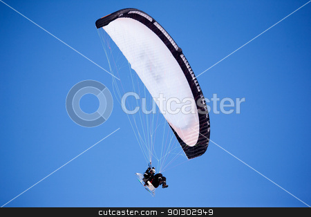 To use this stock image in your creative project, please select the size you need over to the right and click the "Add to Cart" button.
Your downloaded image will come with the Cutcaster watermark removed so don’t worry about the watermark you see on this page. Paraglider stock photo, A paraglider isolated against a deep blue sky by Tyler Olson
