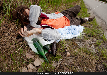 To use this stock image in your creative project, please select the size you need over to the right and click the "Add to Cart" button.
Your downloaded image will come with the Cutcaster watermark removed so don’t worry about the watermark you see on this page. Drunk Man stock photo, A drunk man laying in the ditch with beer bottles by Tyler Olson