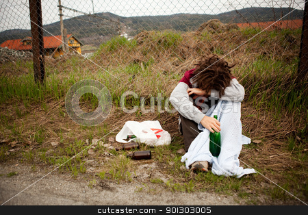 To use this stock image in your creative project, please select the size you need over to the right and click the "Add to Cart" button.
Your downloaded image will come with the Cutcaster watermark removed so don’t worry about the watermark you see on this page. Drunk Homeless Man stock photo, A homeless person sleeping in the ditch by Tyler Olson
