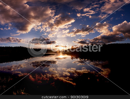 To use this stock image in your creative project, please select the size you need over to the right and click the "Add to Cart" button.
Your downloaded image will come with the Cutcaster watermark removed so don’t worry about the watermark you see on this page. Lake stock photo, A dramatic sunset on a beautiful lake, Buskerud, Norway by Tyler Olson