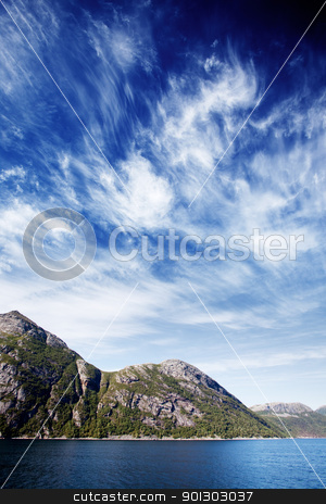 To use this stock image in your creative project, please select the size you need over to the right and click the "Add to Cart" button.
Your downloaded image will come with the Cutcaster watermark removed so don’t worry about the watermark you see on this page. Norway Fjord Landscape stock photo, Mountains on a coastal landscape in northern Norway by Tyler Olson