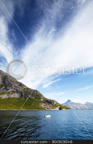To use this stock image in your creative project, please select the size you need over to the right and click the "Add to Cart" button.
Your downloaded image will come with the Cutcaster watermark removed so don’t worry about the watermark you see on this page. Fjord Norway stock photo, A Norwegian fjord with a small white boat by Tyler Olson