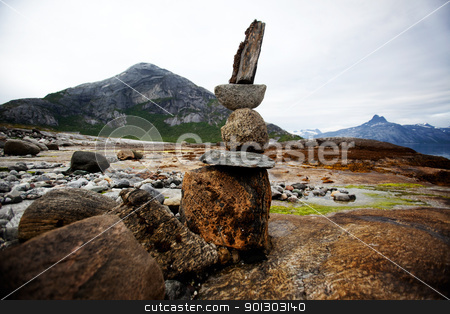 To use this stock image in your creative project, please select the size you need over to the right and click the "Add to Cart" button.
Your downloaded image will come with the Cutcaster watermark removed so don’t worry about the watermark you see on this page. Rock Stack Sculpture stock photo, A rock stacking sculpture statue on a Norwegian landscape by Tyler Olson