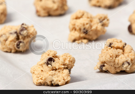 To use this stock image in your creative project, please select the size you need over to the right and click the "Add to Cart" button.
Your downloaded image will come with the Cutcaster watermark removed so don’t worry about the watermark you see on this page. Raw Cookie Dough stock photo, Raw cookie dough on a baking sheet with parchment by Tyler Olson