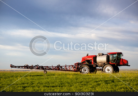 To use this stock image in your creative project, please select the size you need over to the right and click the "Add to Cart" button.
Your downloaded image will come with the Cutcaster watermark removed so don’t worry about the watermark you see on this page. High Clearance Sprayer stock photo, A high clearance sprayer on a field in a prairie landscape by Tyler Olson