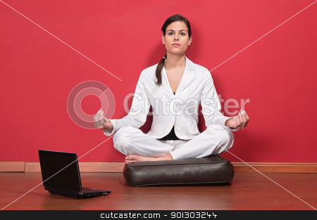 To use this stock image in your creative project, please select the size you need over to the right and click the "Add to Cart" button.
Your downloaded image will come with the Cutcaster watermark removed so don’t worry about the watermark you see on this page. Businesswoman sitting in yoga lotus position stock photo, Young businesswoman sitting in yoga lotus position with laptop on the floor by Tyler Olson