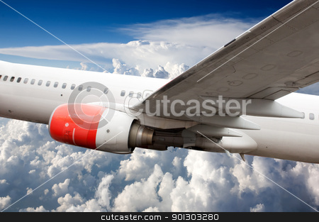 To use this stock image in your creative project, please select the size you need over to the right and click the "Add to Cart" button.
Your downloaded image will come with the Cutcaster watermark removed so don’t worry about the watermark you see on this page. Airplane in Flight stock photo, A large commercial passenger airplane in flight over clouds by Tyler Olson
