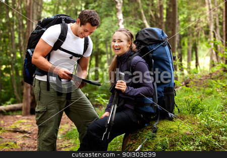 To use this stock image in your creative project, please select the size you need over to the right and click the "Add to Cart" button.
Your downloaded image will come with the Cutcaster watermark removed so don’t worry about the watermark you see on this page. Happy Campers stock photo, A couple with smiles looking at a map in the forest by Tyler Olson