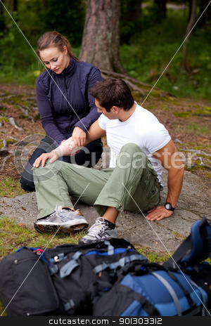 To use this stock image in your creative project, please select the size you need over to the right and click the "Add to Cart" button.
Your downloaded image will come with the Cutcaster watermark removed so don’t worry about the watermark you see on this page. Camping First Aid stock photo, A woman applying an arm bandage on a male camper - focus on male face by Tyler Olson
