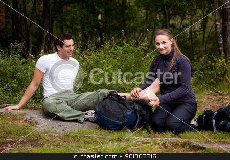 To use this stock image in your creative project, please select the size you need over to the right and click the "Add to Cart" button.
Your downloaded image will come with the Cutcaster watermark removed so don’t worry about the watermark you see on this page. Camping First Aid stock photo, A couple camping and putting on a leg bandage by Tyler Olson
