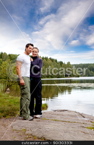 To use this stock image in your creative project, please select the size you need over to the right and click the "Add to Cart" button.
Your downloaded image will come with the Cutcaster watermark removed so don’t worry about the watermark you see on this page. Outdoor Couple Portrait stock photo, A outdoors couple portrait by a lake and forest by Tyler Olson