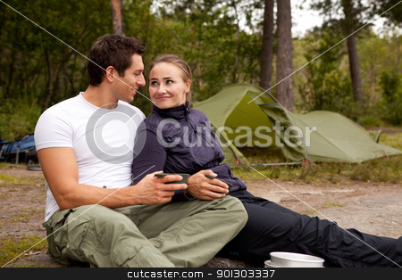 To use this stock image in your creative project, please select the size you need over to the right and click the "Add to Cart" button.
Your downloaded image will come with the Cutcaster watermark removed so don’t worry about the watermark you see on this page. Happy Couple stock photo, A happy couple outdoors on a camping trip by Tyler Olson