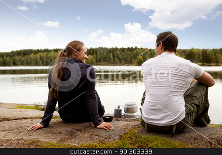 To use this stock image in your creative project, please select the size you need over to the right and click the "Add to Cart" button.
Your downloaded image will come with the Cutcaster watermark removed so don’t worry about the watermark you see on this page. Man and Woman Camping stock photo, A man and woman happy camping in the forest by a lake by Tyler Olson