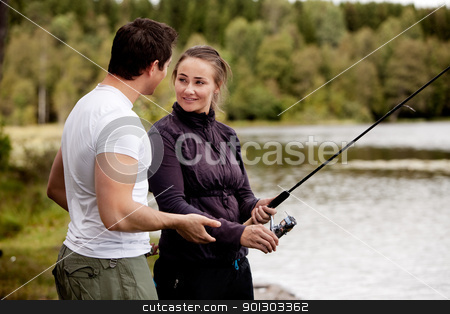 To use this stock image in your creative project, please select the size you need over to the right and click the "Add to Cart" button.
Your downloaded image will come with the Cutcaster watermark removed so don’t worry about the watermark you see on this page. Woman Fishing stock photo, A woman fishing - showing a man by Tyler Olson