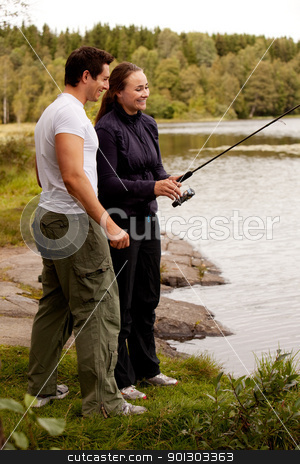 To use this stock image in your creative project, please select the size you need over to the right and click the "Add to Cart" button.
Your downloaded image will come with the Cutcaster watermark removed so don’t worry about the watermark you see on this page. Fishing Fun stock photo, A young adult couple having fun fishing on a forest lake. by Tyler Olson