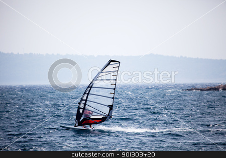 To use this stock image in your creative project, please select the size you need over to the right and click the "Add to Cart" button.
Your downloaded image will come with the Cutcaster watermark removed so don’t worry about the watermark you see on this page. Wind Surfing stock photo, A wind surfer on the ocean by Tyler Olson