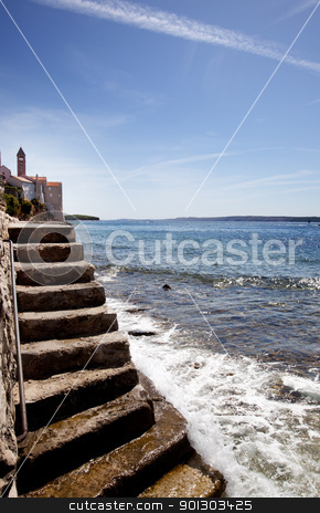 To use this stock image in your creative project, please select the size you need over to the right and click the "Add to Cart" button.
Your downloaded image will come with the Cutcaster watermark removed so don’t worry about the watermark you see on this page. Stone Stairway Ocean stock photo, A stone staircase down to the ocean - Rab Croatia by Tyler Olson