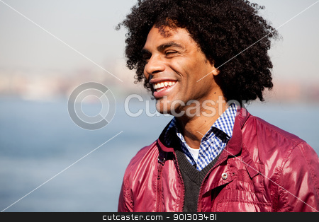 To use this stock image in your creative project, please select the size you need over to the right and click the "Add to Cart" button.
Your downloaded image will come with the Cutcaster watermark removed so don’t worry about the watermark you see on this page. African American stock photo, A portrait of a happy laughing African American man by Tyler Olson
