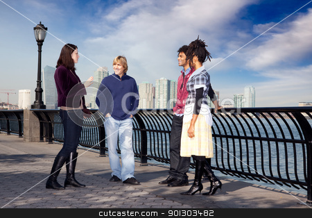 To use this stock image in your creative project, please select the size you need over to the right and click the "Add to Cart" button.
Your downloaded image will come with the Cutcaster watermark removed so don’t worry about the watermark you see on this page. City Friends stock photo, A group of friends on a city walk way by the water by Tyler Olson