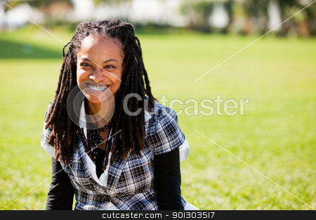 To use this stock image in your creative project, please select the size you need over to the right and click the "Add to Cart" button.
Your downloaded image will come with the Cutcaster watermark removed so don’t worry about the watermark you see on this page. Beautiful African American stock photo, A beautiful African American woman isolated on grass by Tyler Olson
