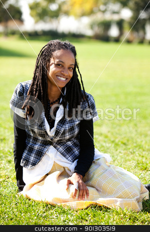 To use this stock image in your creative project, please select the size you need over to the right and click the "Add to Cart" button.
Your downloaded image will come with the Cutcaster watermark removed so don’t worry about the watermark you see on this page. African American Student stock photo, A young African American student sitting on grass by Tyler Olson