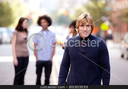 To use this stock image in your creative project, please select the size you need over to the right and click the "Add to Cart" button.
Your downloaded image will come with the Cutcaster watermark removed so don’t worry about the watermark you see on this page. Urban People City stock photo, A group of people in a city setting - a caucasian male in the foreground by Tyler Olson