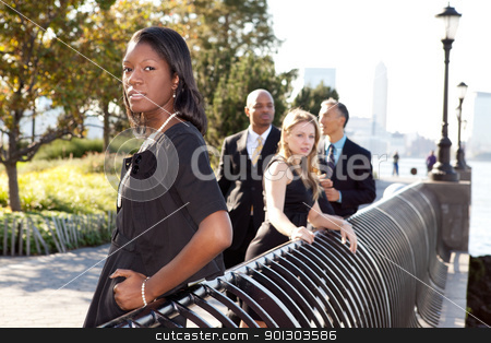 To use this stock image in your creative project, please select the size you need over to the right and click the "Add to Cart" button.
Your downloaded image will come with the Cutcaster watermark removed so don’t worry about the watermark you see on this page. Business Team stock photo, A business team outside - sharp focus on front woman by Tyler Olson