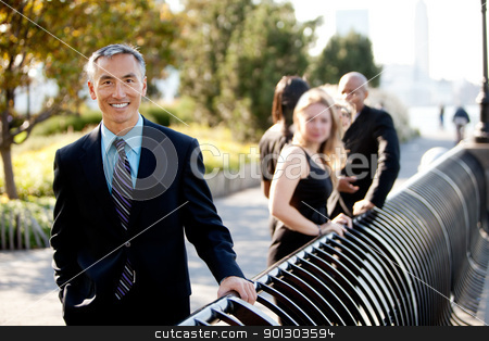 To use this stock image in your creative project, please select the size you need over to the right and click the "Add to Cart" button.
Your downloaded image will come with the Cutcaster watermark removed so don’t worry about the watermark you see on this page. Asian Business Man stock photo, A group of business people outside - sharp focus on Asian man in foreground by Tyler Olson