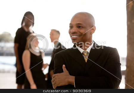 To use this stock image in your creative project, please select the size you need over to the right and click the "Add to Cart" button.
Your downloaded image will come with the Cutcaster watermark removed so don’t worry about the watermark you see on this page. Business Man stock photo, A happy African American business man by Tyler Olson